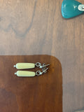 Unknown | White elongated earrings